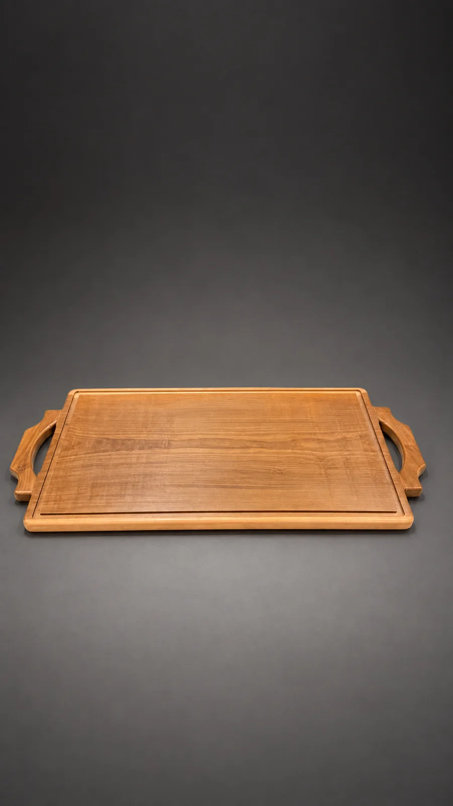 Tabla Parrillera de Lapacho Grande de 70 × 40 cm, con las manijas de madera talladas